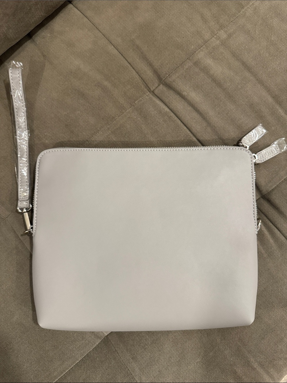 the mumi x NEAT Method collaboration Travel Clutch